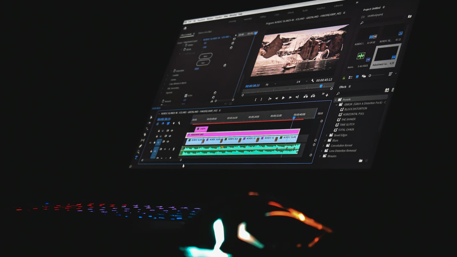 A computer monitor showing video editing software with a timeline and a preview window
